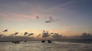 Preview wallpaper sea, boats, silhouettes, sky, dark