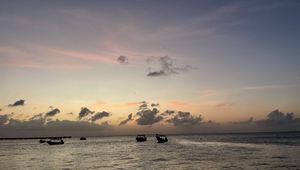 Preview wallpaper sea, boats, silhouettes, sky, dark