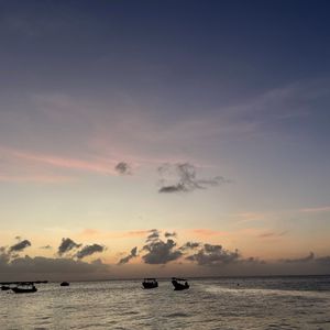 Preview wallpaper sea, boats, silhouettes, sky, dark