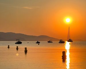 Preview wallpaper sea, boats, sunset, horizon, hills