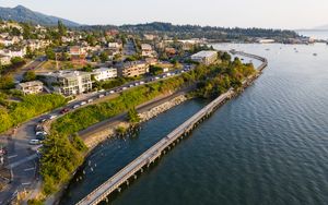 Preview wallpaper sea, building, bridge, trees