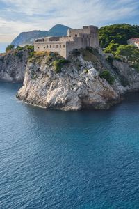 Preview wallpaper sea, buildings, castle, rocks