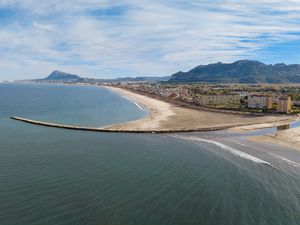 Preview wallpaper sea, buildings, coast, city, mountains