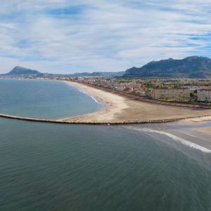 Preview wallpaper sea, buildings, coast, city, mountains