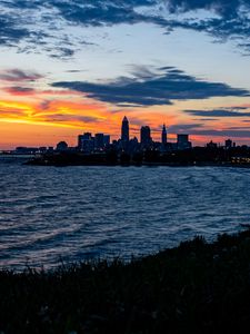 Preview wallpaper sea, city, coast, buildings, twilight