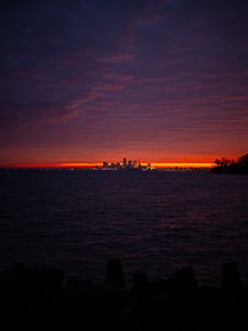 Preview wallpaper sea, city, lights, buildings, dark