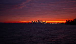 Preview wallpaper sea, city, lights, buildings, dark