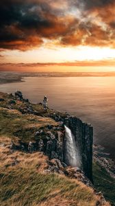 Preview wallpaper sea, cliff, waterfall, sunset, landscape