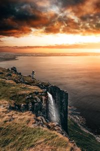 Preview wallpaper sea, cliff, waterfall, sunset, landscape