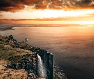 Preview wallpaper sea, cliff, waterfall, sunset, landscape