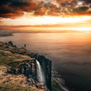 Preview wallpaper sea, cliff, waterfall, sunset, landscape