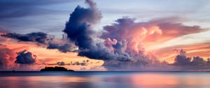 Preview wallpaper sea, clouds, horizon, island, sky, sunset