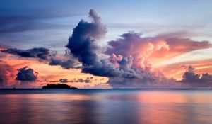 Preview wallpaper sea, clouds, horizon, island, sky, sunset