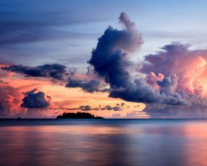 Preview wallpaper sea, clouds, horizon, island, sky, sunset