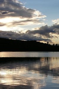 Preview wallpaper sea, clouds, horizon, evening, outlines, trees, reflection