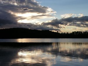 Preview wallpaper sea, clouds, horizon, evening, outlines, trees, reflection