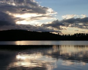 Preview wallpaper sea, clouds, horizon, evening, outlines, trees, reflection