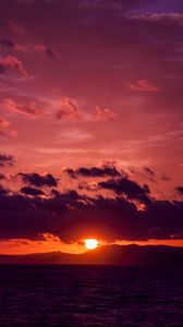 Preview wallpaper sea, clouds, mountains, sunset, dark