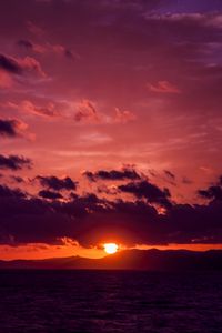 Preview wallpaper sea, clouds, mountains, sunset, dark
