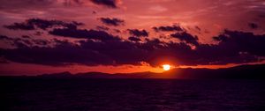 Preview wallpaper sea, clouds, mountains, sunset, dark