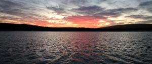 Preview wallpaper sea, clouds, sky, hills, silhouettes, nature