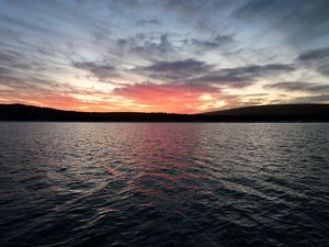 Preview wallpaper sea, clouds, sky, hills, silhouettes, nature