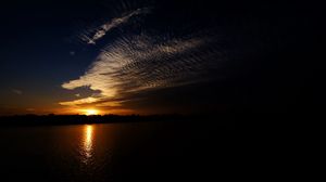 Preview wallpaper sea, clouds, sun, sunset, landscape, dark