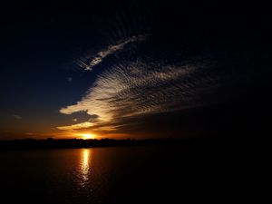 Preview wallpaper sea, clouds, sun, sunset, landscape, dark