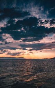 Preview wallpaper sea, clouds, sunlight, ripples, shore, mountains