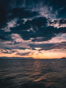 Preview wallpaper sea, clouds, sunlight, ripples, shore, mountains