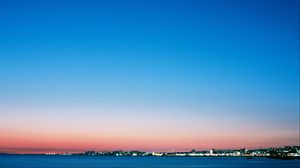 Preview wallpaper sea, coast, city, dusk, landscape