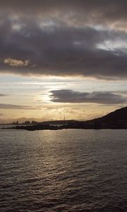 Preview wallpaper sea, coast, island, evening, clouds