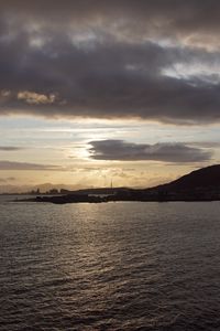 Preview wallpaper sea, coast, island, evening, clouds