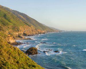 Preview wallpaper sea, coast, mountains, grass, landscape