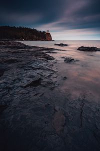 Preview wallpaper sea, coast, rocks, cliff, lighthouse