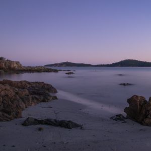 Preview wallpaper sea, coast, rocks, island, dusk