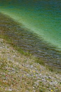 Preview wallpaper sea, coast, stones, grass, pebbles