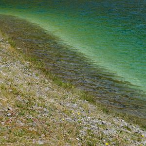 Preview wallpaper sea, coast, stones, grass, pebbles