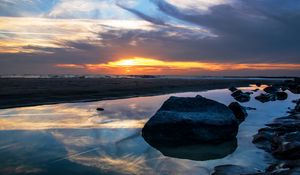 Preview wallpaper sea, coast, stones, sunset, dusk, landscape