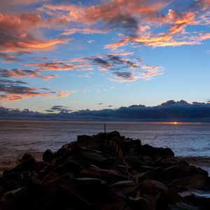 Preview wallpaper sea, coast, stones, sunset, landscape