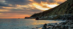 Preview wallpaper sea, coast, stones, buildings, bay