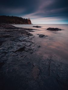 Preview wallpaper sea, coast, sunset, stones, water, fog