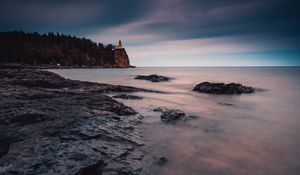 Preview wallpaper sea, coast, sunset, stones, water, fog