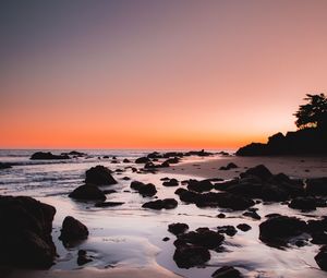 Preview wallpaper sea, coast, sunset, stones, sand, horizon