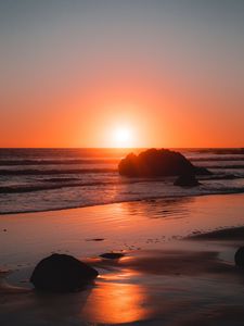 Preview wallpaper sea, coast, sunset, stones, waves, horizon