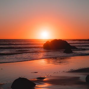 Preview wallpaper sea, coast, sunset, stones, waves, horizon