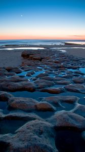 Preview wallpaper sea, coast, sunset, sand, stones, horizon