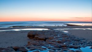 Preview wallpaper sea, coast, sunset, sand, stones, horizon