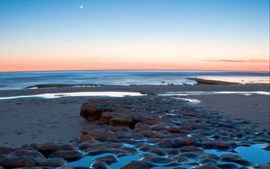 Preview wallpaper sea, coast, sunset, sand, stones, horizon