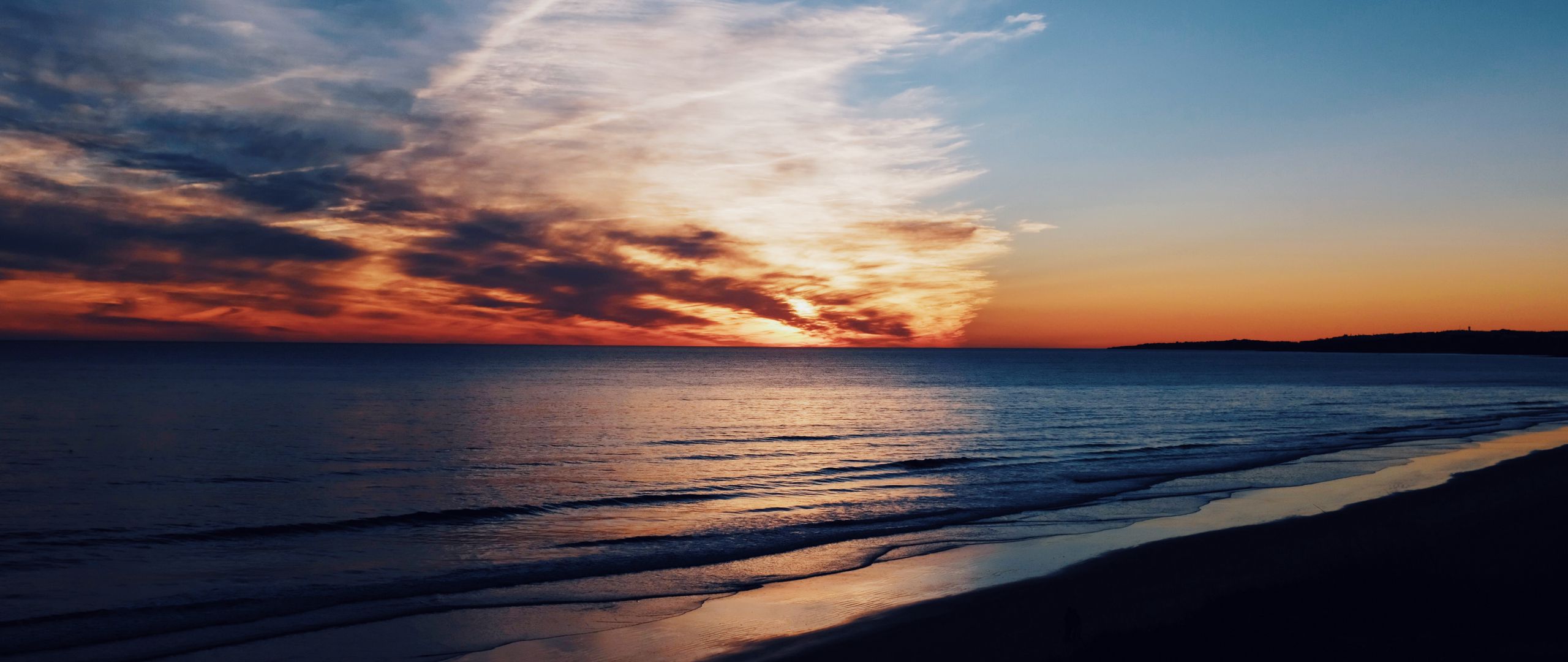 Download wallpaper 2560x1080 sea, coast, sunset, clouds, horizon